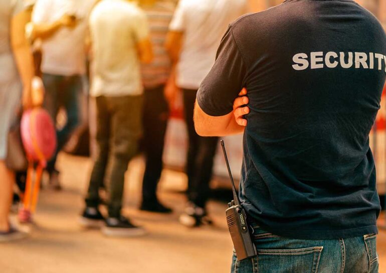 Security guard at live festivale event standing in front
