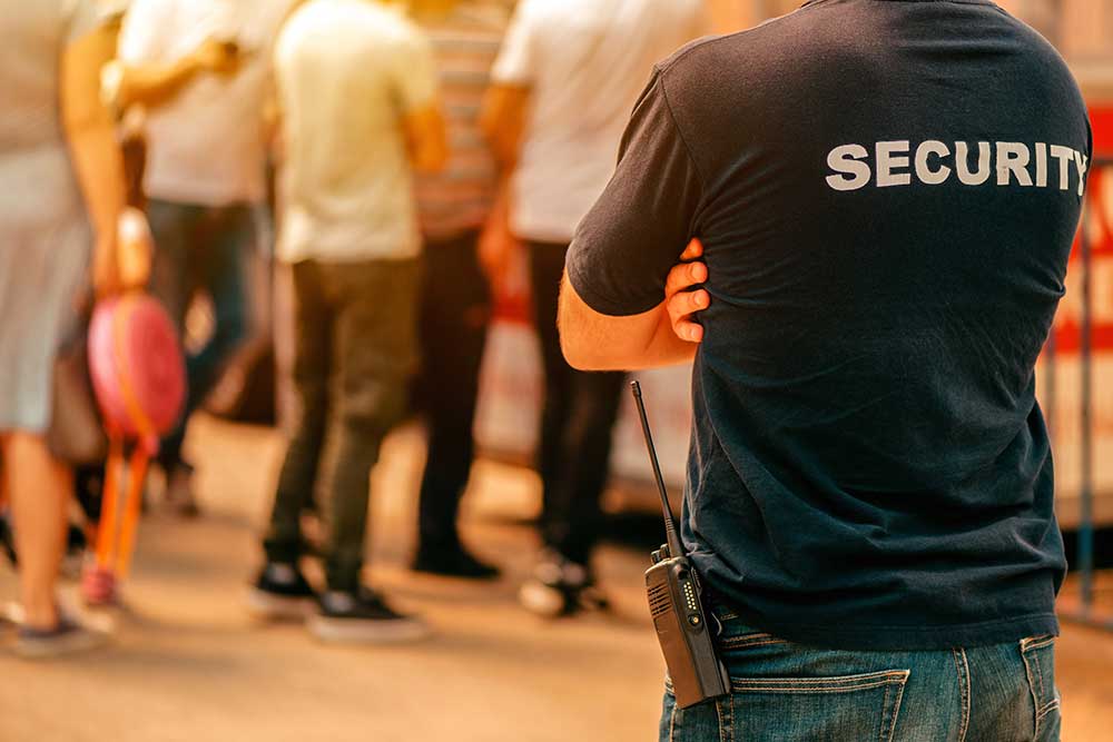 Security guard at live festivale event standing in front