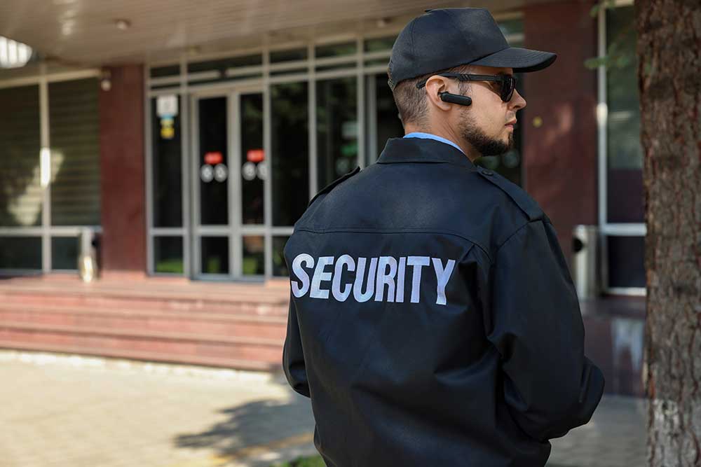 Security guard in uniform and sunglasses outdoors